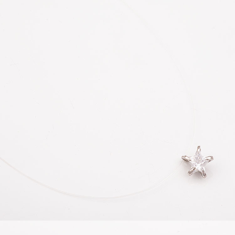 Fishing line necklace with a K14 white gold star motif.