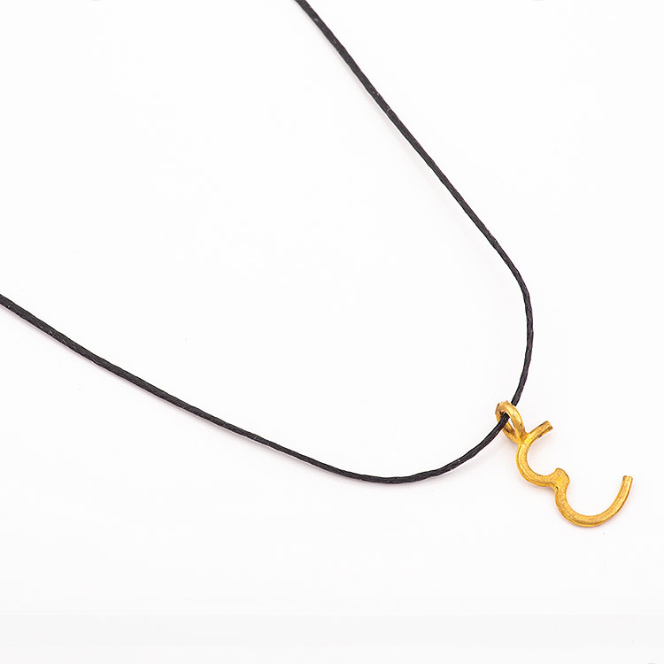 Black cord necklace with a K18 gold letter “E” motif