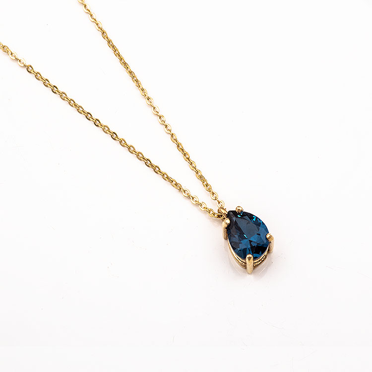 K14 gold necklace with a teardrop-shaped London Blue stone.