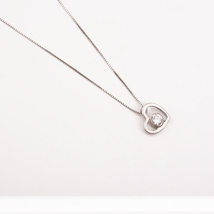 K14 white gold necklace with an oblique heart charm.