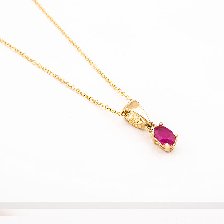 K14 gold necklace with an oval red stone.