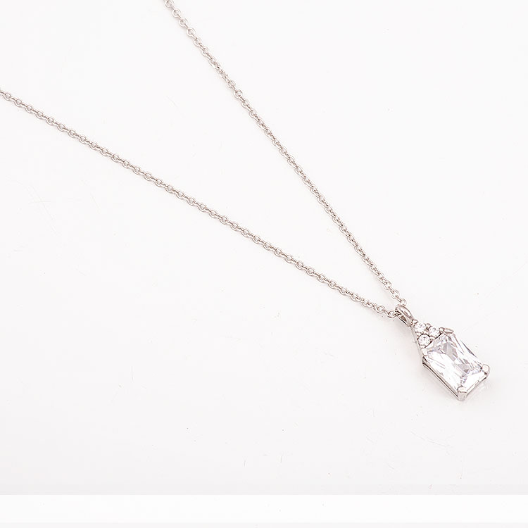 K9 white gold necklace with a rectangular white stone.