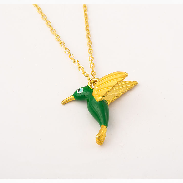 Silver gold-plated enamel hummingbird necklace.