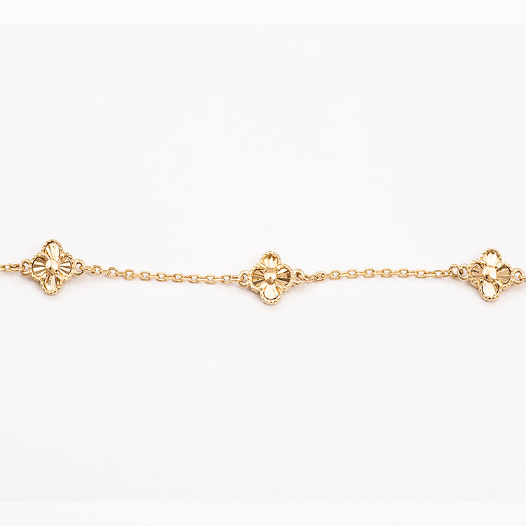 K14 gold bracelet with tiny cross charms and a chain.
