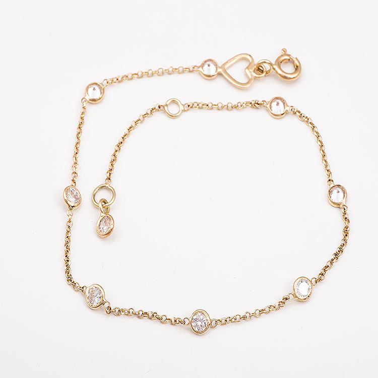 K14 gold bracelet with stones and a chain.