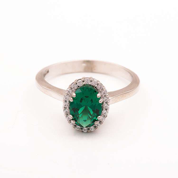 Λευκόχρυσο δαχτυλίδι Κ9 οβάλ ροζέτα με πράσινη πέτρα.