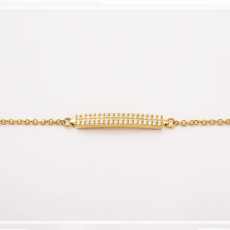 K9 gold bar bracelet with stones.
