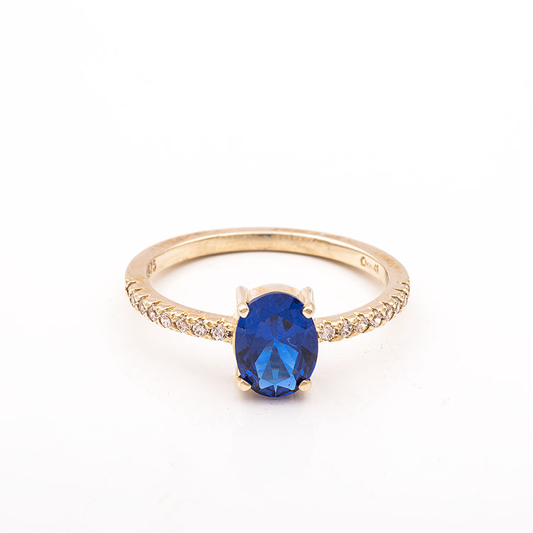 Χρυσό δαχτυλίδι Κ9 με οβάλ μπλε πέτρα.
