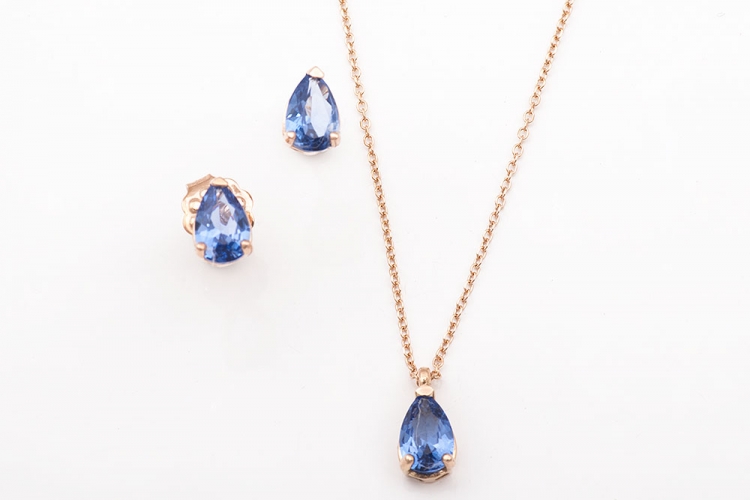 Σετ, κολιέ και σκουλαρίκια σε ροζ χρυσό Κ14 με γαλάζια πέτρα σε σχήμα δάκρυ.
